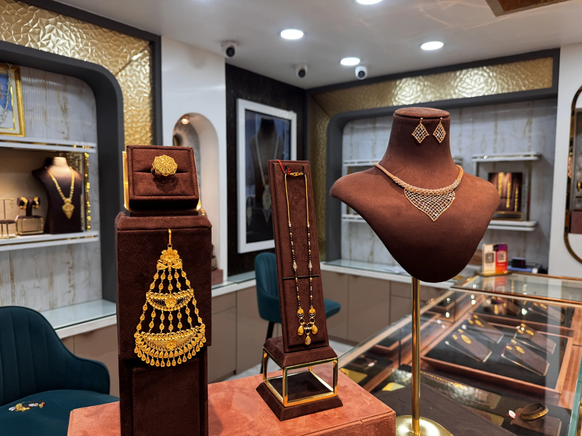 Inside the Jeweller Kalika Prasad showroom — gold jhoomar pendant, mangalsutra and diamond necklace on display in Shibpur, Howrah