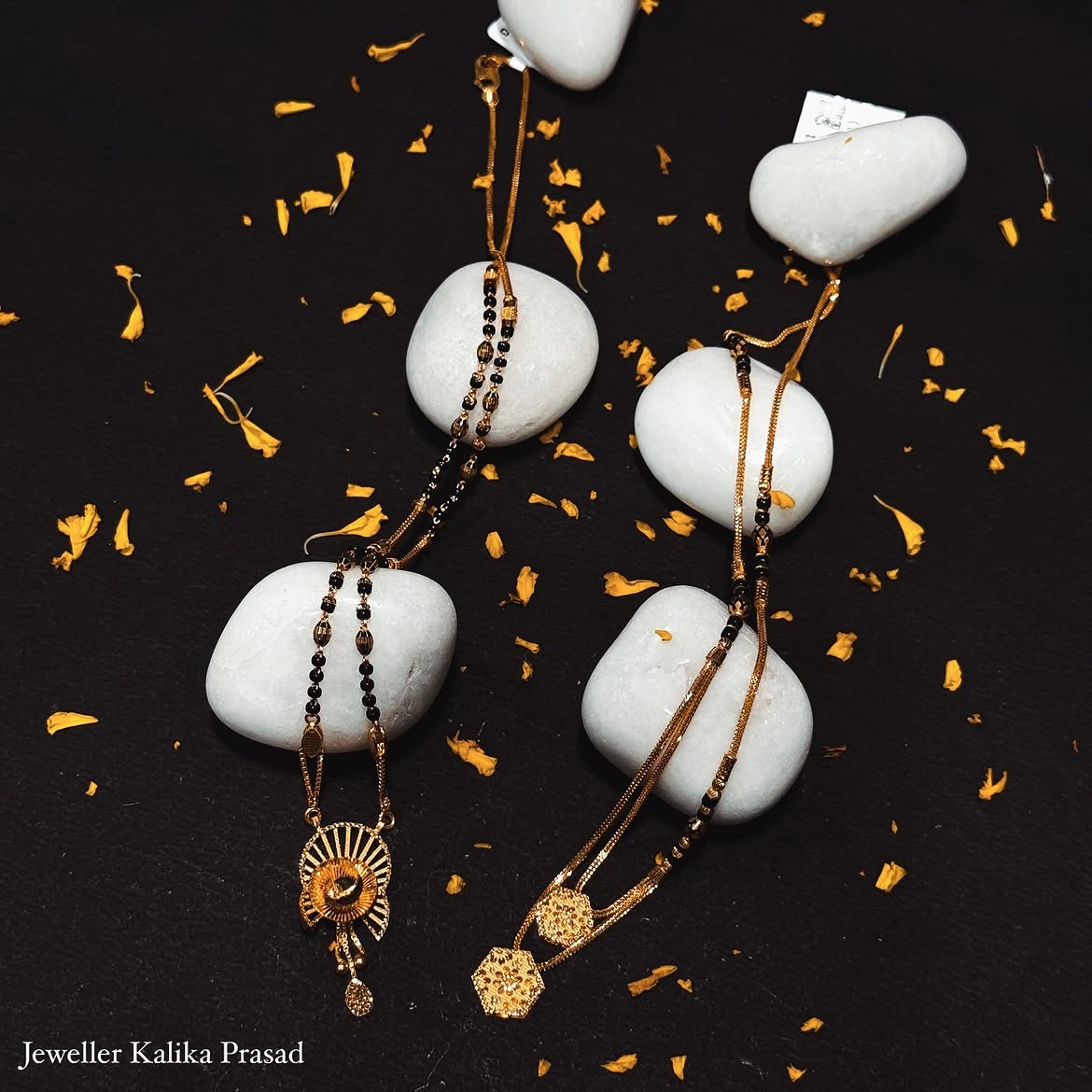 Gold mangalsutras styled with white stones and petals
