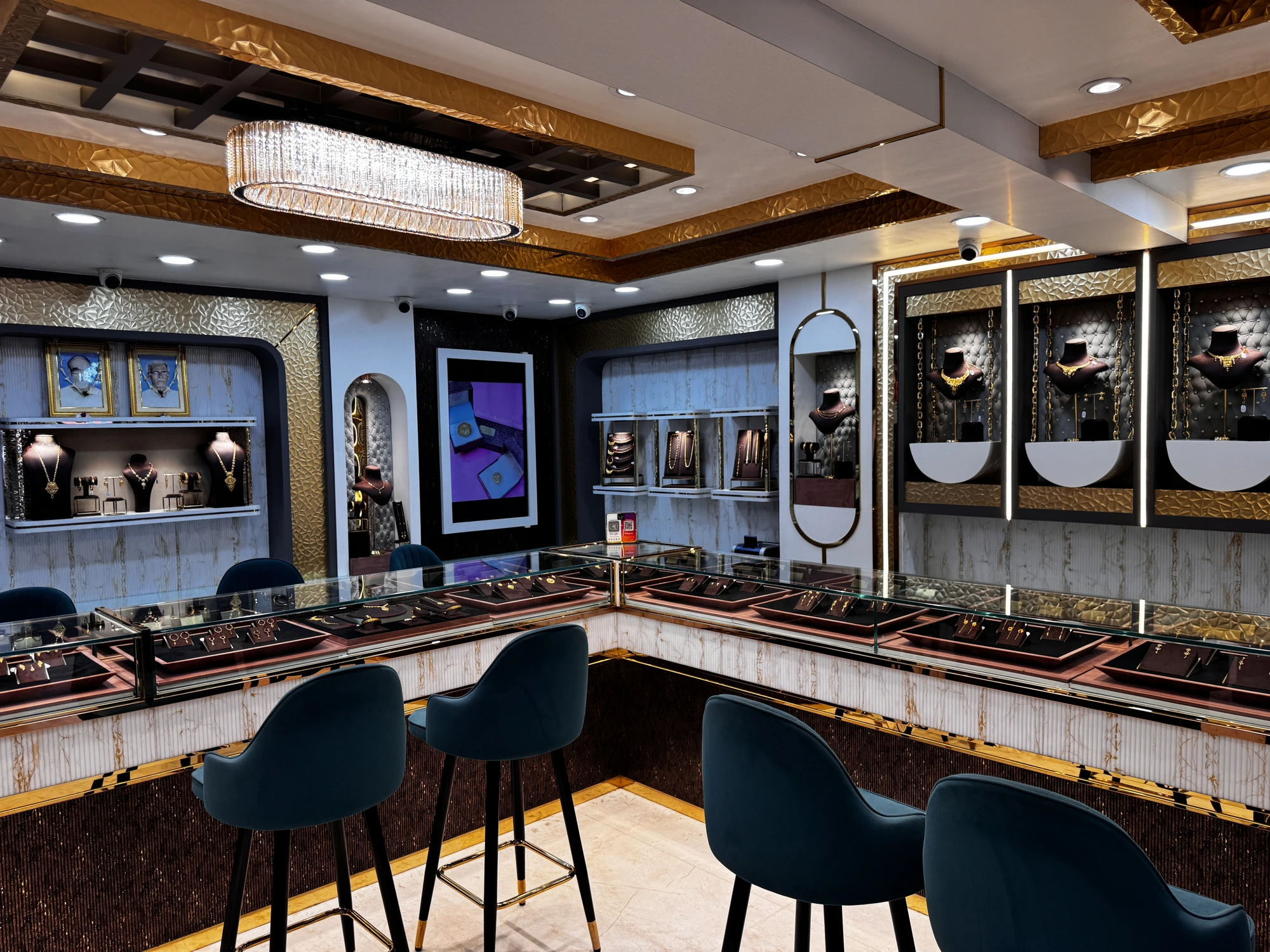 Wall display niches with gold necklaces and chains at Jeweller Kalika Prasad